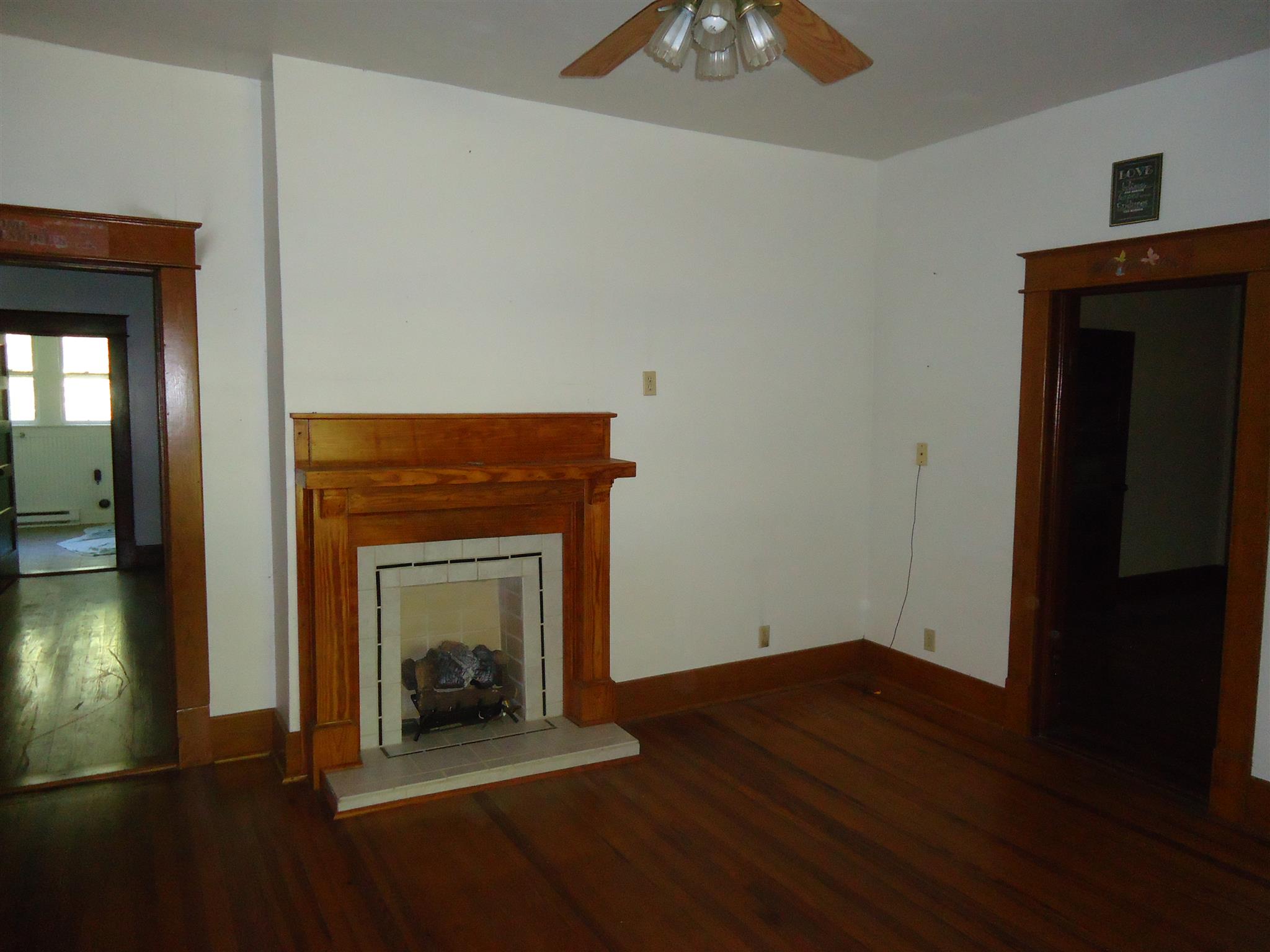 161 Bee Road Prospect, TN 38477 - Photo 9 of 19 a view of a livingroom with wooden floor and a fireplace