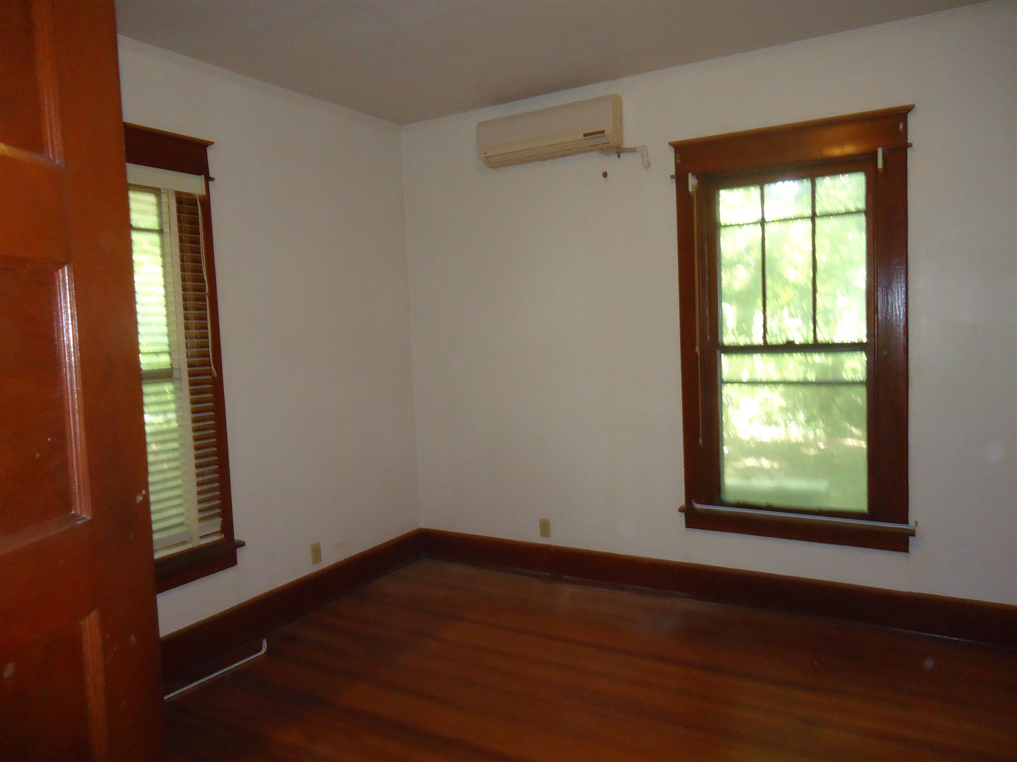 161 Bee Road Prospect, TN 38477 - Photo 10 of 19 a view of an empty room with wooden floor and a window