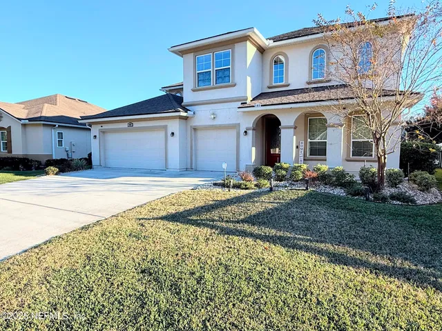 a kitchen with granite countertop stainless steel appliances a sink stove top oven and cabinets
