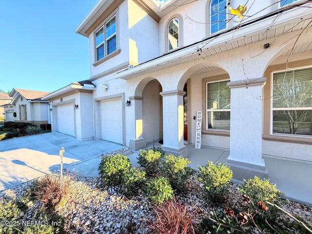 a kitchen with kitchen island granite countertop a sink stove and cabinets