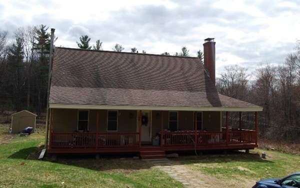 48 Rockingstone Park Road Barre, MA 01005 - Photo 1 of 17 a front view of a house with a garden