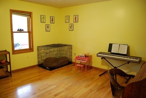 48 Rockingstone Park Road Barre, MA 01005 - Photo 13 of 17 a bedroom with a bed and wooden floor