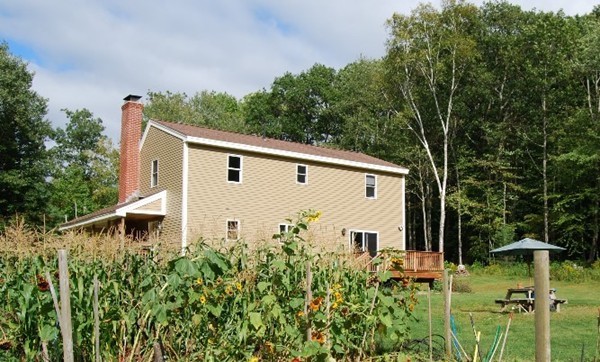 48 Rockingstone Park Road Barre, MA 01005 - Photo 2 of 17 a front view of a house with a yard