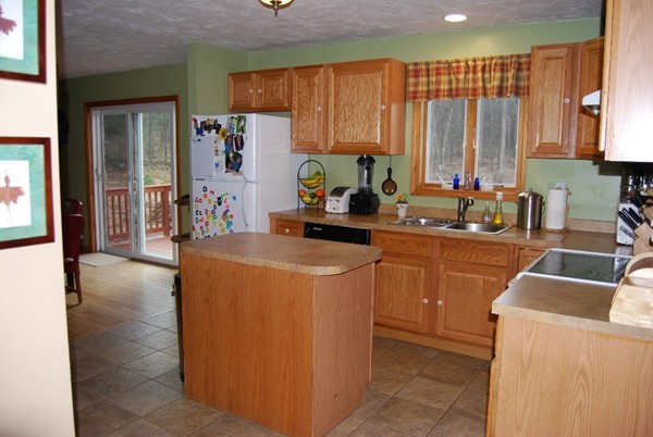 48 Rockingstone Park Road Barre, MA 01005 - Photo 4 of 17 a kitchen with sink a refrigerator and cabinets