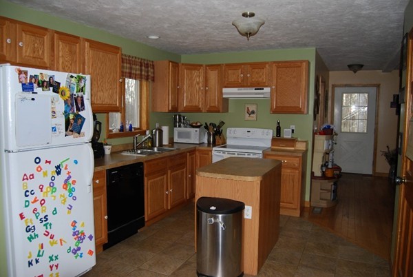 48 Rockingstone Park Road Barre, MA 01005 - Photo 5 of 17 a kitchen with a refrigerator and a sink