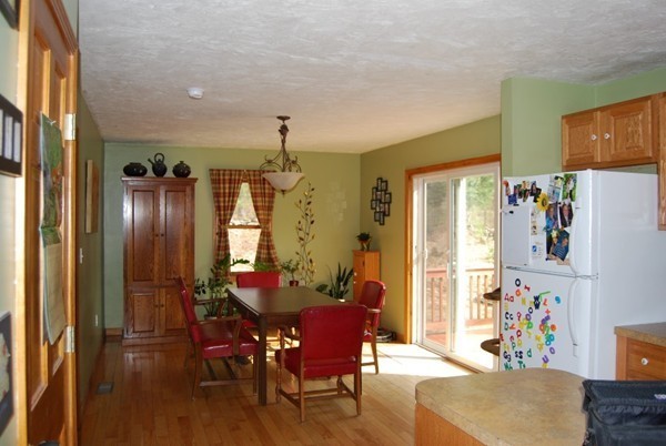 48 Rockingstone Park Road Barre, MA 01005 - Photo 6 of 17 a view of a dining room with furniture window and wooden floor