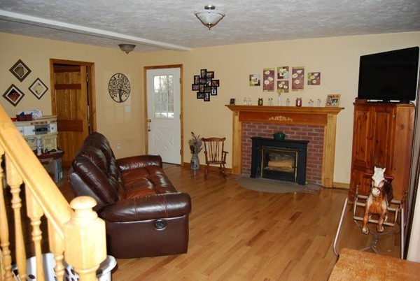 48 Rockingstone Park Road Barre, MA 01005 - Photo 7 of 17 a living room with furniture and a fireplace