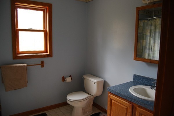 48 Rockingstone Park Road Barre, MA 01005 - Photo 9 of 17 a bathroom with a granite countertop toilet a sink and a window