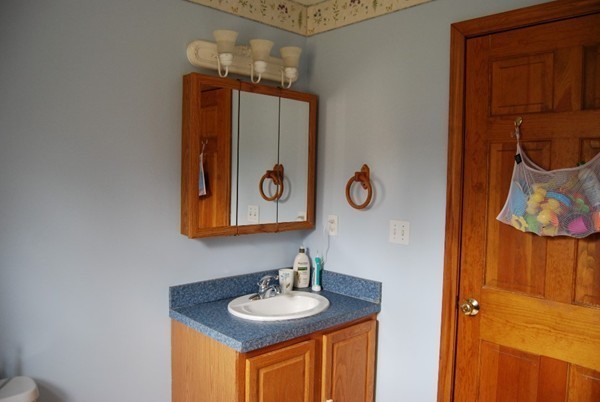 48 Rockingstone Park Road Barre, MA 01005 - Photo 10 of 17 a bathroom with a sink and a mirror