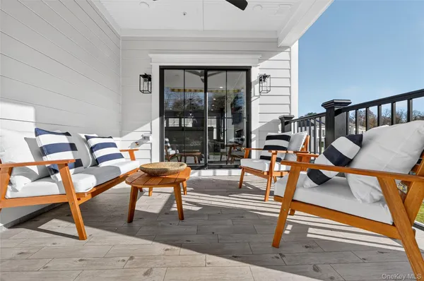 a swimming pool with outdoor seating and yard