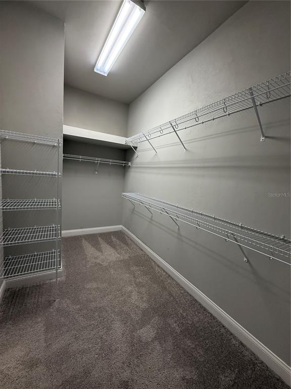 11822 Southwest 34th Road Gainesville, FL 32608 - Photo 13 of 24 a view of a room with racks on the wall