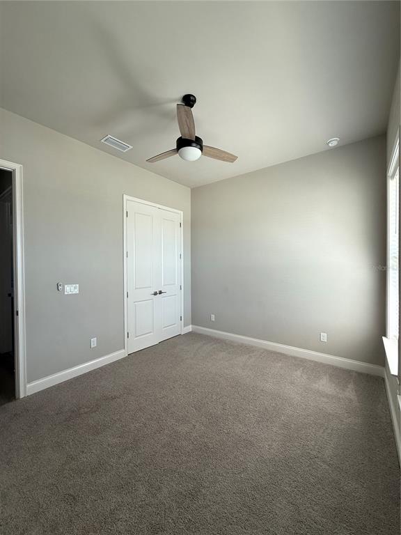 11822 Southwest 34th Road Gainesville, FL 32608 - Photo 14 of 24 a view of an empty room with a window