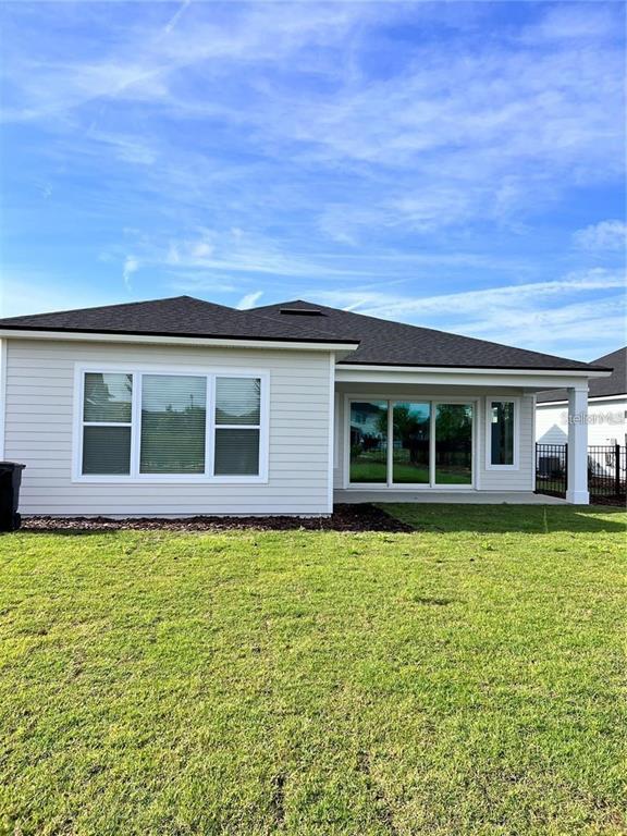 11822 Southwest 34th Road Gainesville, FL 32608 - Photo 18 of 24 a house view with a garden space