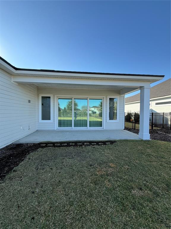 11822 Southwest 34th Road Gainesville, FL 32608 - Photo 20 of 24 a view of a house with backyard