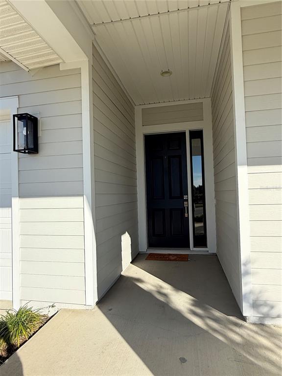 11822 Southwest 34th Road Gainesville, FL 32608 - Photo 3 of 24 a front view of a house with a garage