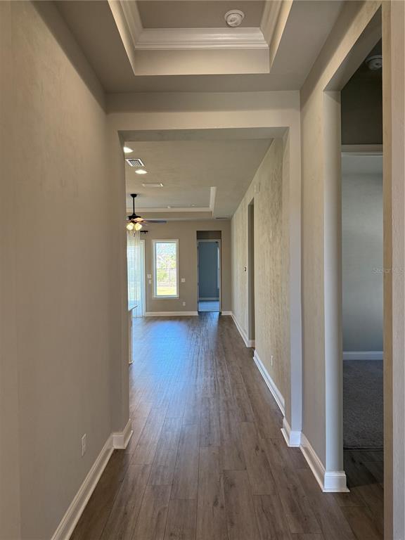 11822 Southwest 34th Road Gainesville, FL 32608 - Photo 5 of 24 a view of a hallway with wooden floor and closet