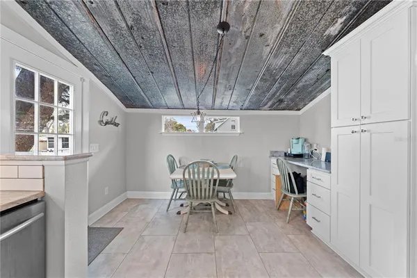 a view of a hallway with seating area
