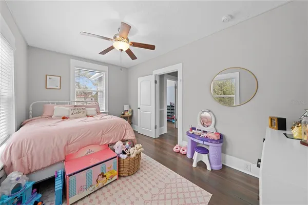 a bedroom with a bed and dresser