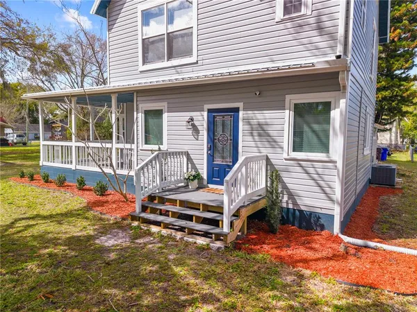 a backyard of a house with seating space