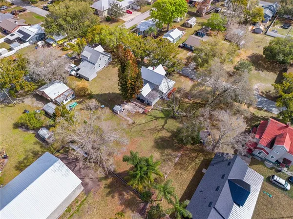 a view of a house with snow in the backyard
