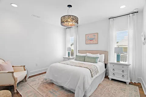 a bedroom with a large bed and furniture