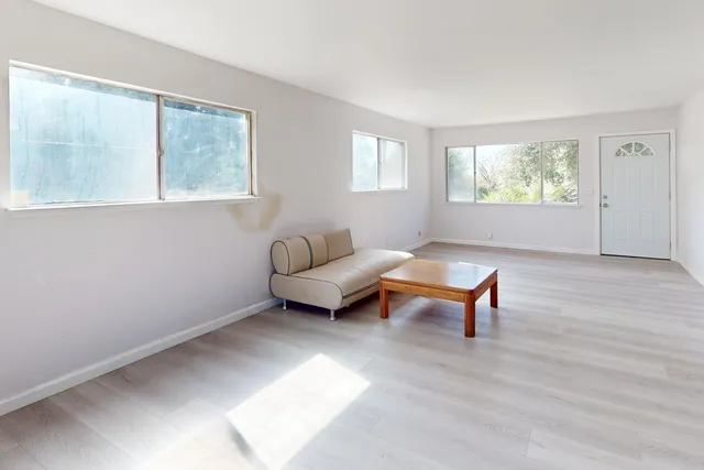 a kitchen with cabinets a sink and appliances