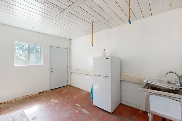 an aerial view of a house with lake view