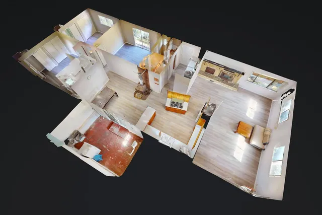 a view of a field with trees in background