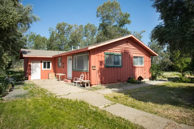 a backyard of a house with lots of green space