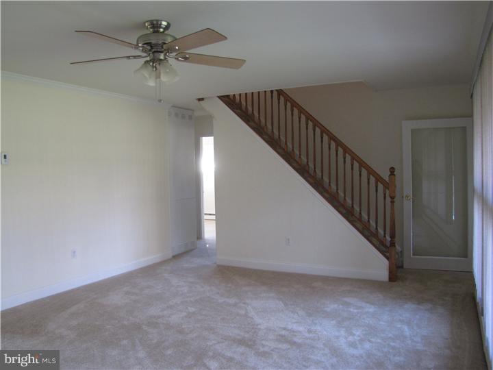 18 Tinder Road Levittown, PA 19056 - Photo 14 of 25 a view of an empty room with a chandelier fan