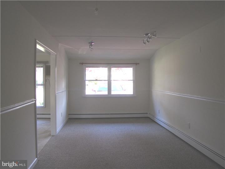 18 Tinder Road Levittown, PA 19056 - Photo 15 of 25 an empty room with a empty space and windows