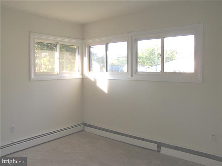 18 Tinder Road Levittown, PA 19056 - Photo 16 of 25 an empty room with a window
