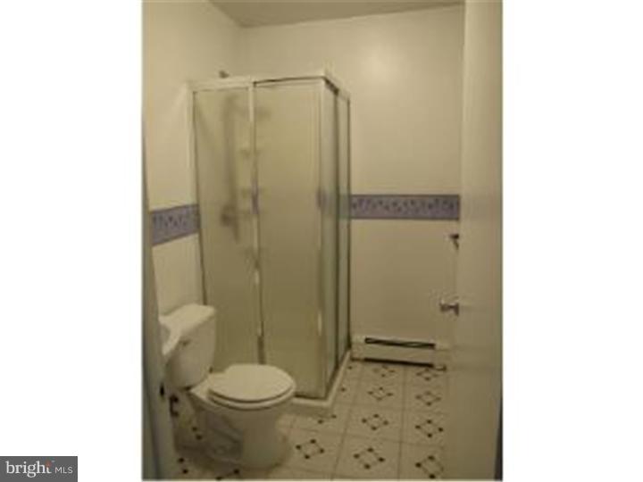 18 Tinder Road Levittown, PA 19056 - Photo 5 of 25 a bathroom with a toilet and a shower