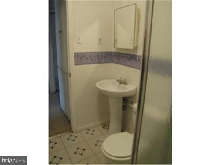 18 Tinder Road Levittown, PA 19056 - Photo 6 of 25 a bathroom with a toilet and a sink