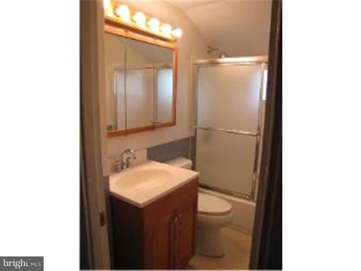 18 Tinder Road Levittown, PA 19056 - Photo 8 of 25 a bathroom with a sink and a mirror