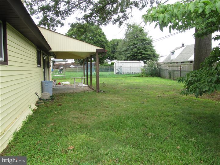 18 Tinder Road Levittown, PA 19056 - Photo 10 of 25 a view of a backyard with a garden