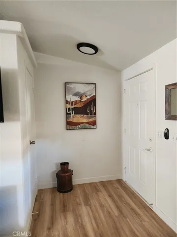 a room with furniture and wooden floor