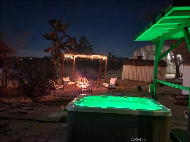 a view of yard with patio