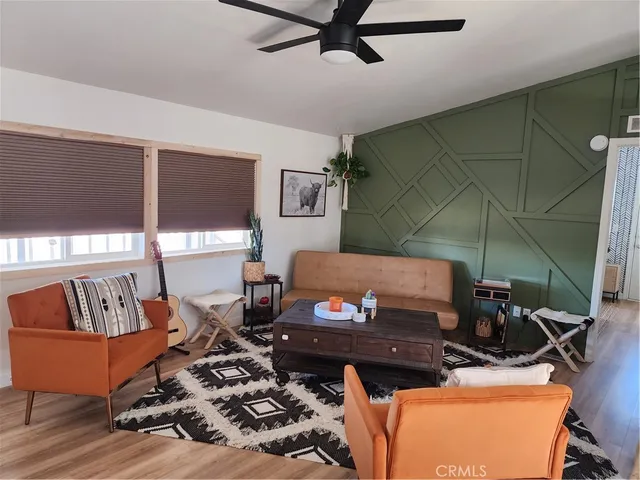 a living room with a couch and a window
