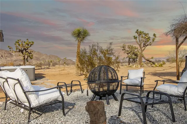 a view of swimming pool with outdoor seating