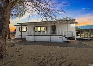 a view of a house with a street
