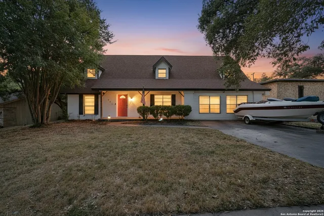 a view of a house with car parked