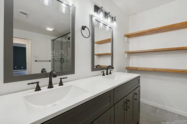 a bathroom with a sink and a mirror