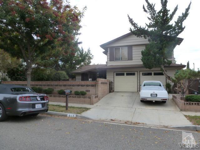 917 Appleton Road Simi Valley, CA 93065 - Photo 1 of 14 a car parked in front of a house