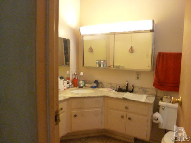 917 Appleton Road Simi Valley, CA 93065 - Photo 12 of 14 a bathroom with a sink and a mirror