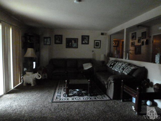 917 Appleton Road Simi Valley, CA 93065 - Photo 8 of 14 a living room with furniture and a fireplace