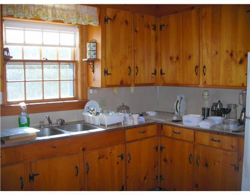 67 Roberts Ridge Road Waterboro, ME 04030 - Photo 7 of 25 Kitchen. Knotty Pine Cabinets