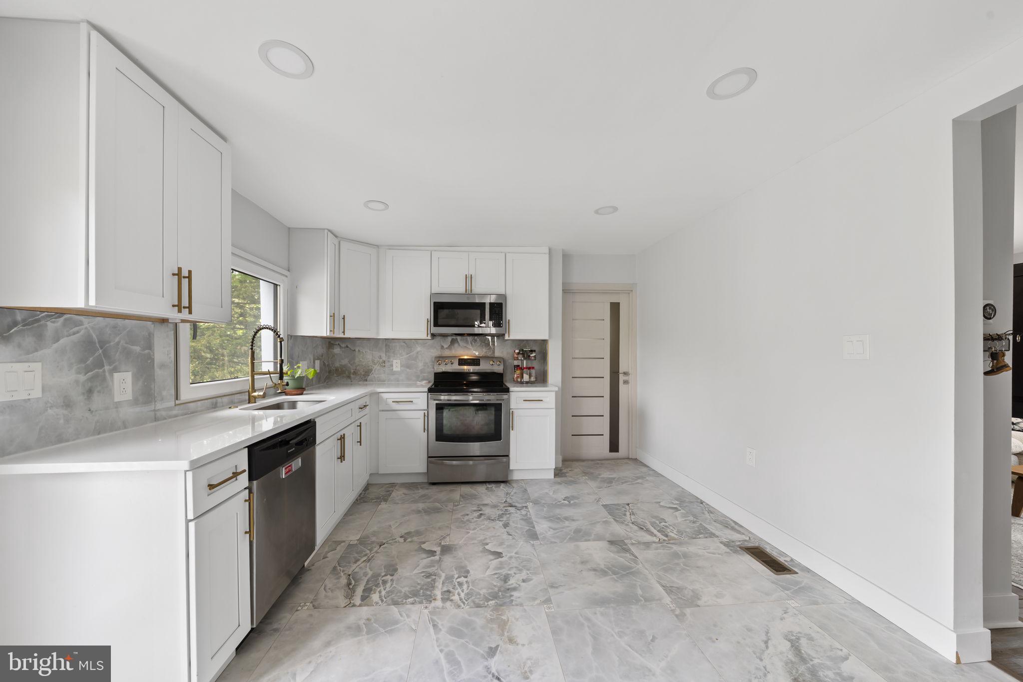 2549 Church Road Glenside, PA 19038 - Photo 14 of 40 Sleek modern kitchen with elegant finishes.
