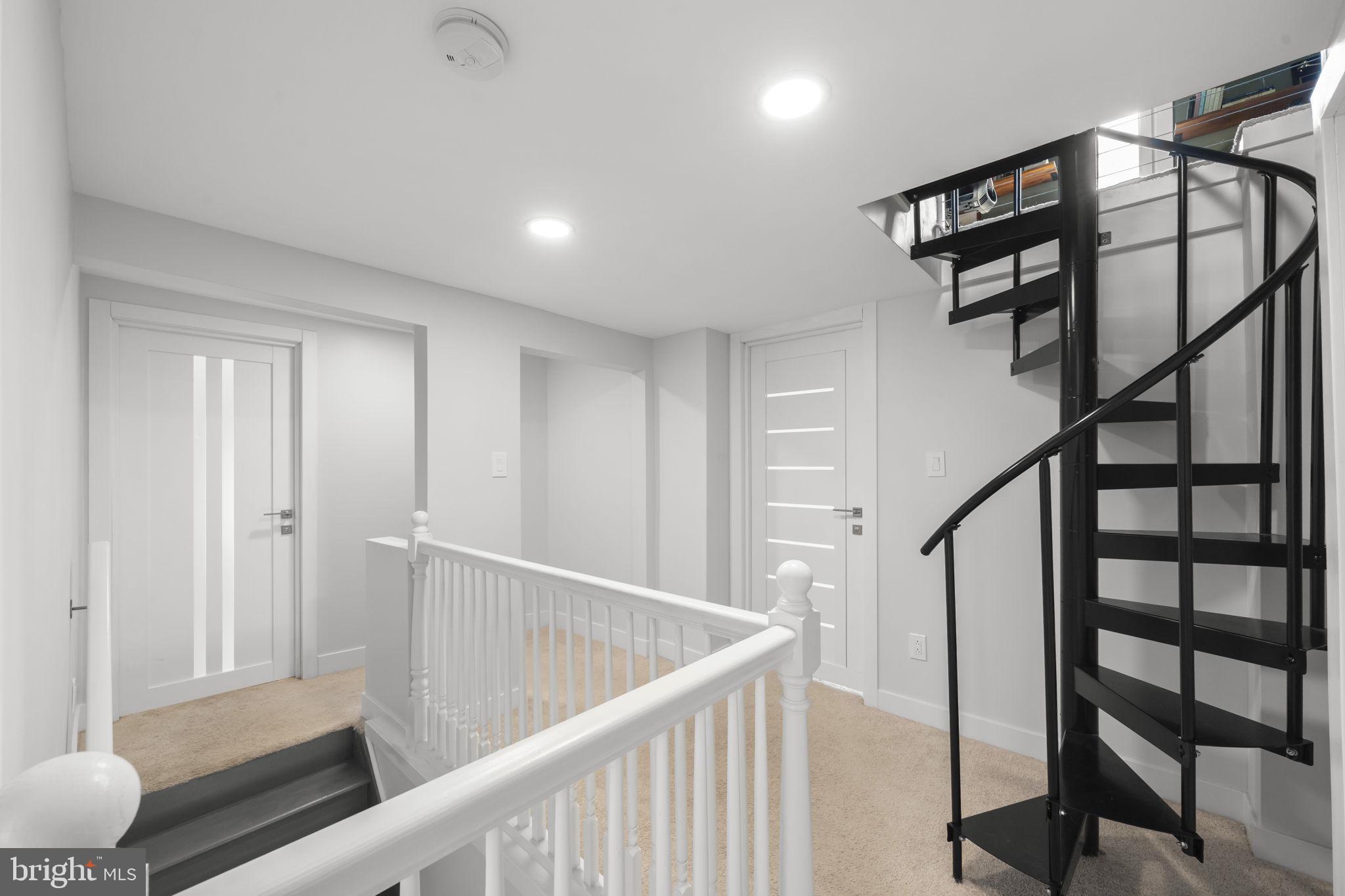 2549 Church Road Glenside, PA 19038 - Photo 34 of 40 Modern spiral staircase in bright hall.