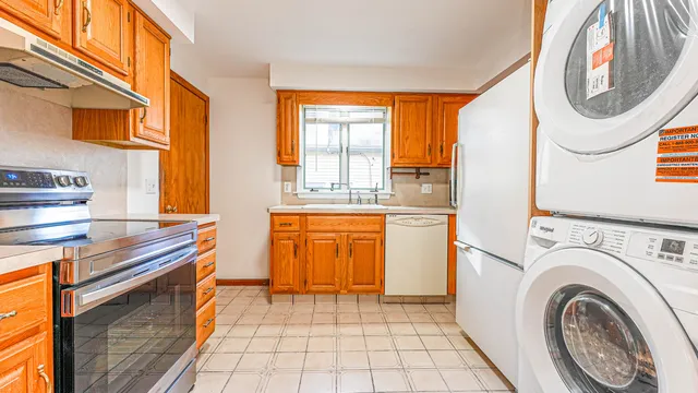 a kitchen with a sink and a stove top oven